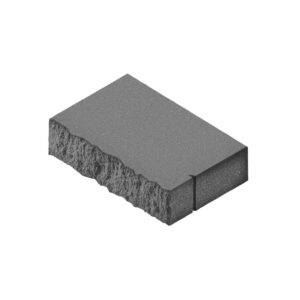 Isometric view of a textured concrete block with a rough left face and a smooth top surface, showing a narrow vertical notch on the right edge.